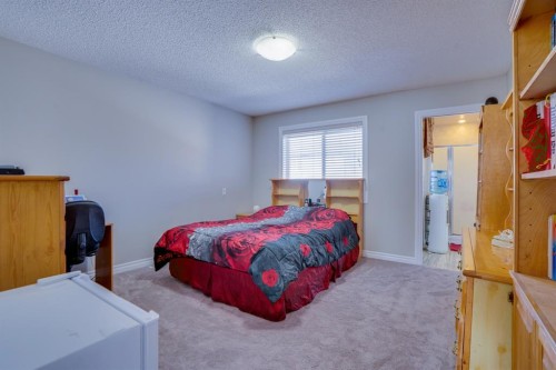 77 Saddleland Drive Ne, Calgary, AB - Indoor Photo Showing Bedroom