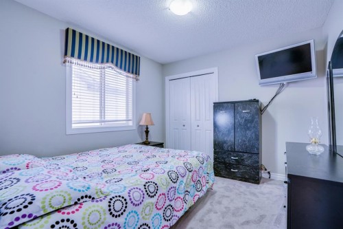 77 Saddleland Drive Ne, Calgary, AB - Indoor Photo Showing Bedroom