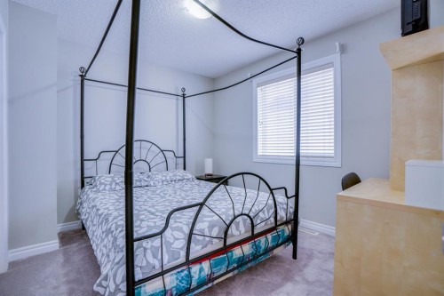 77 Saddleland Drive Ne, Calgary, AB - Indoor Photo Showing Bedroom