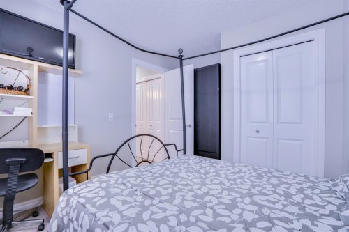 77 Saddleland Drive Ne, Calgary, AB - Indoor Photo Showing Bedroom