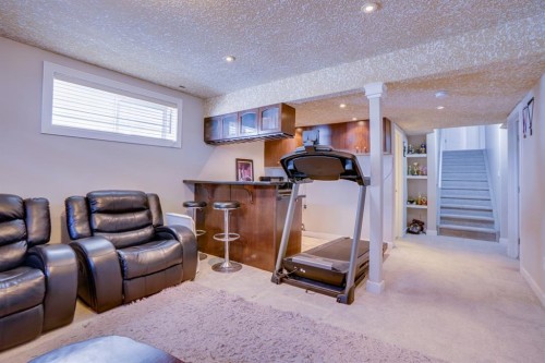 77 Saddleland Drive Ne, Calgary, AB - Indoor Photo Showing Gym Room