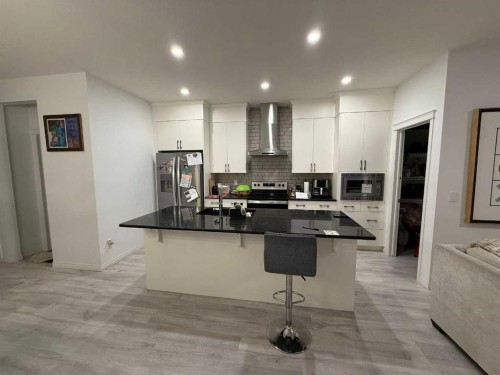 119 Edith Drive Nw, Calgary, AB - Indoor Photo Showing Kitchen With Upgraded Kitchen
