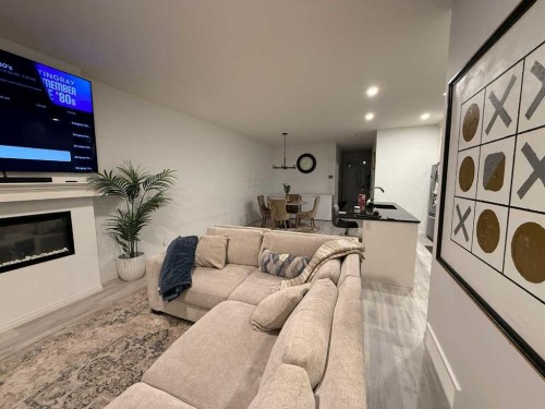 119 Edith Drive Nw, Calgary, AB - Indoor Photo Showing Living Room With Fireplace