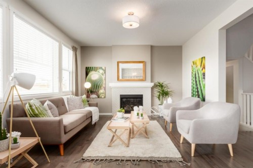 63 Creekside Path Sw, Calgary, AB - Indoor Photo Showing Living Room With Fireplace