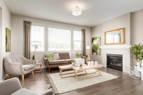 63 Creekside Path Sw, Calgary, AB - Indoor Photo Showing Living Room With Fireplace