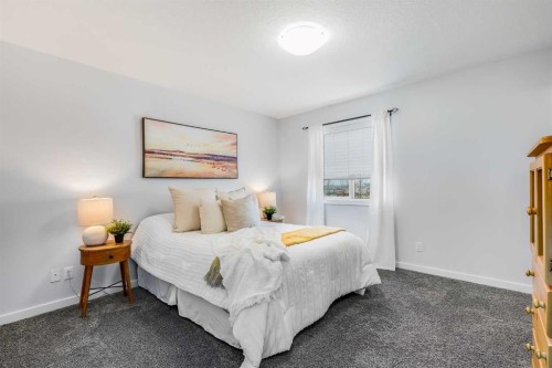 251 Kingsbridge Road Se, Airdrie, AB - Indoor Photo Showing Bedroom