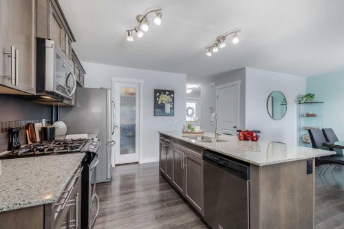 251 Kingsbridge Road Se, Airdrie, AB - Indoor Photo Showing Kitchen With Double Sink With Upgraded Kitchen