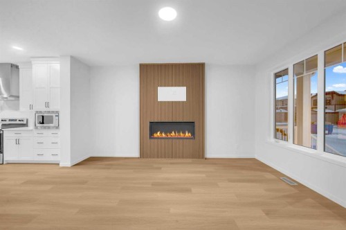 94 Royston Park Nw, Calgary, AB - Indoor With Fireplace