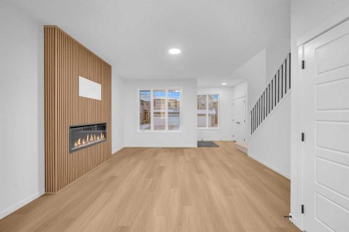 94 Royston Park Nw, Calgary, AB - Indoor With Fireplace