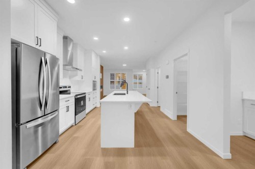 94 Royston Park Nw, Calgary, AB - Indoor Photo Showing Kitchen With Stainless Steel Kitchen With Upgraded Kitchen