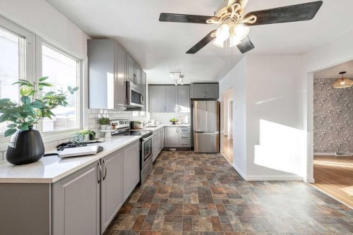 31 Arbour Crescent Se, Calgary, AB - Indoor Photo Showing Kitchen With Double Sink