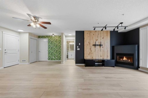 106-102 Cranberry Park Se, Calgary, AB - Indoor With Fireplace