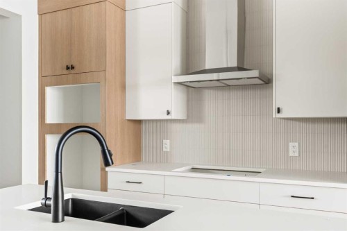 46 Starling Boulevard Nw, Calgary, AB - Indoor Photo Showing Kitchen With Double Sink