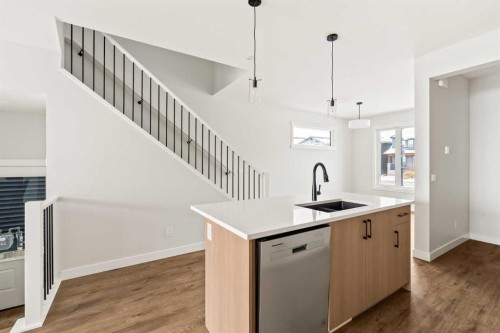 46 Starling Boulevard Nw, Calgary, AB - Indoor Photo Showing Kitchen With Double Sink With Upgraded Kitchen