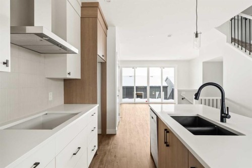 46 Starling Boulevard Nw, Calgary, AB - Indoor Photo Showing Kitchen With Double Sink