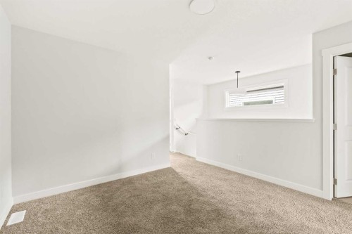46 Starling Boulevard Nw, Calgary, AB - Indoor Photo Showing Other Room