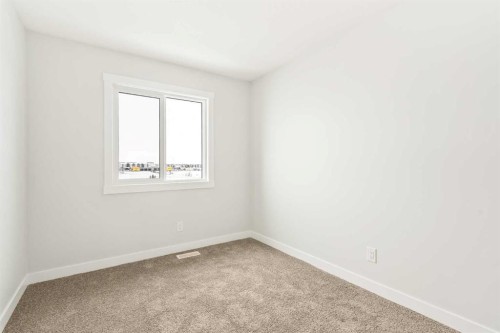46 Starling Boulevard Nw, Calgary, AB - Indoor Photo Showing Other Room