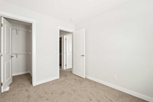 46 Starling Boulevard Nw, Calgary, AB - Indoor Photo Showing Other Room