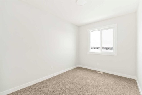 46 Starling Boulevard Nw, Calgary, AB - Indoor Photo Showing Other Room