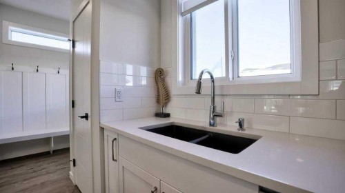 770 Wolf Willow Boulevard Se, Calgary, AB - Indoor Photo Showing Kitchen With Double Sink