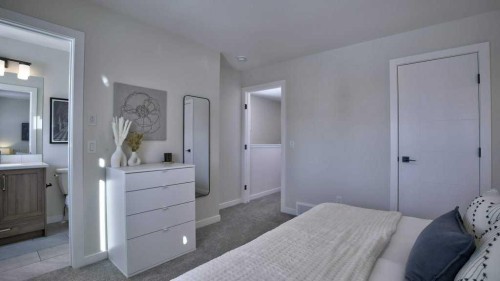 770 Wolf Willow Boulevard Se, Calgary, AB - Indoor Photo Showing Bedroom