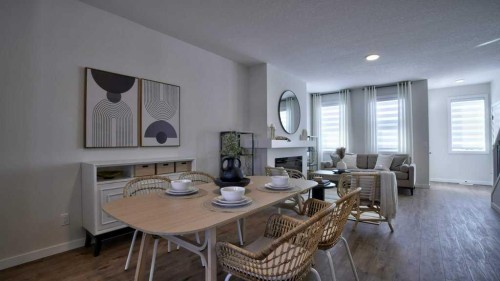 770 Wolf Willow Boulevard Se, Calgary, AB - Indoor Photo Showing Dining Room With Fireplace