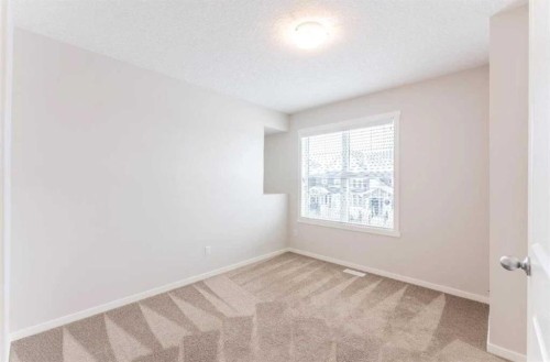 12 Legacy Main Street Se, Calgary, AB - Indoor Photo Showing Other Room