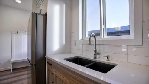 774 Wolf Willow Boulevard Se, Calgary, AB - Indoor Photo Showing Kitchen With Double Sink