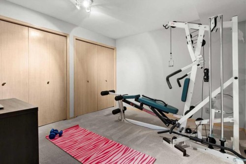 75 Hawkside Close Nw, Calgary, AB - Indoor Photo Showing Gym Room