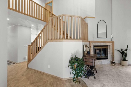 75 Hawkside Close Nw, Calgary, AB - Indoor Photo Showing Other Room With Fireplace