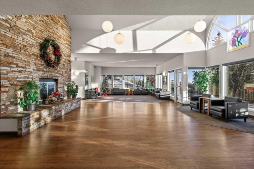 75 Hawkside Close Nw, Calgary, AB - Indoor Photo Showing Living Room With Fireplace