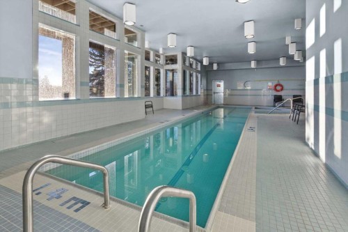 75 Hawkside Close Nw, Calgary, AB - Indoor Photo Showing Other Room With In Ground Pool