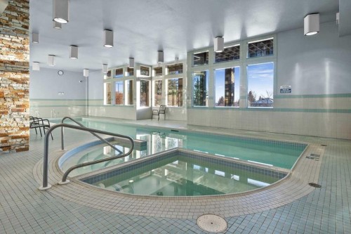 75 Hawkside Close Nw, Calgary, AB - Indoor Photo Showing Other Room With In Ground Pool