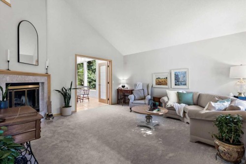 75 Hawkside Close Nw, Calgary, AB - Indoor Photo Showing Living Room With Fireplace