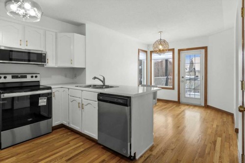 9095 Scurfield Drive Nw, Calgary, AB - Indoor Photo Showing Kitchen With Stainless Steel Kitchen With Double Sink