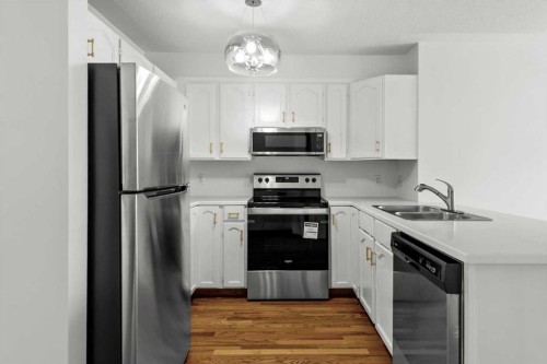 9095 Scurfield Drive Nw, Calgary, AB - Indoor Photo Showing Kitchen With Stainless Steel Kitchen With Double Sink