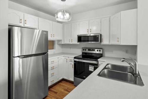 9095 Scurfield Drive Nw, Calgary, AB - Indoor Photo Showing Kitchen With Stainless Steel Kitchen With Double Sink