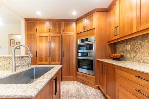 231031 Forestry Way, Bragg Creek, AB - Indoor Photo Showing Kitchen With Upgraded Kitchen