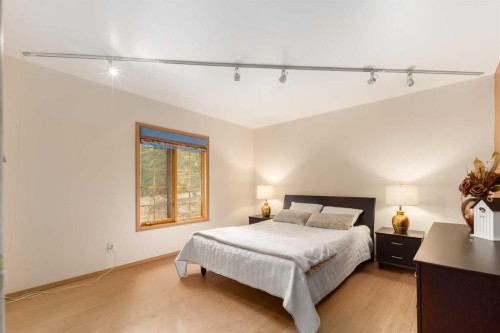231031 Forestry Way, Bragg Creek, AB - Indoor Photo Showing Bedroom