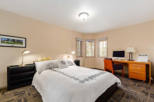 231031 Forestry Way, Bragg Creek, AB - Indoor Photo Showing Bedroom