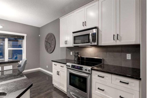 106 Silverado Skies Drive Sw, Calgary, AB - Indoor Photo Showing Kitchen With Upgraded Kitchen