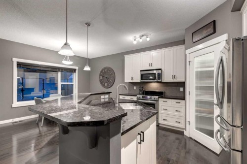 106 Silverado Skies Drive Sw, Calgary, AB - Indoor Photo Showing Kitchen With Upgraded Kitchen