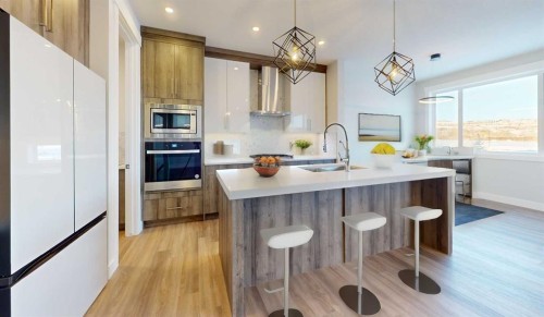 33 Heritage Park, Cochrane, AB - Indoor Photo Showing Kitchen With Upgraded Kitchen