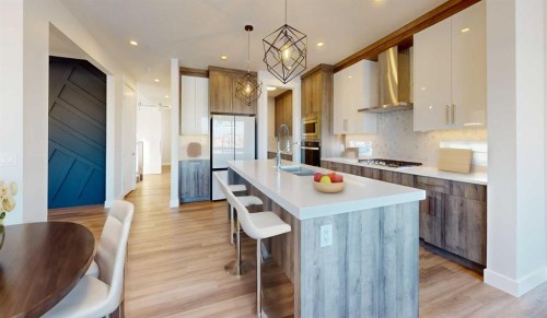 33 Heritage Park, Cochrane, AB - Indoor Photo Showing Kitchen With Upgraded Kitchen