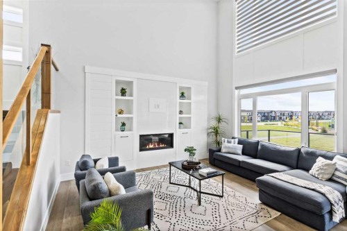 61 Sunvalley View, Cochrane, AB - Indoor Photo Showing Living Room With Fireplace