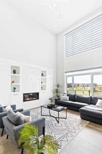 61 Sunvalley View, Cochrane, AB - Indoor Photo Showing Living Room With Fireplace