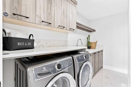 61 Sunvalley View, Cochrane, AB - Indoor Photo Showing Laundry Room