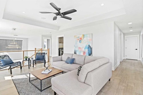 61 Sunvalley View, Cochrane, AB - Indoor Photo Showing Living Room