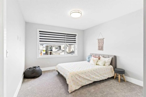 61 Sunvalley View, Cochrane, AB - Indoor Photo Showing Bedroom