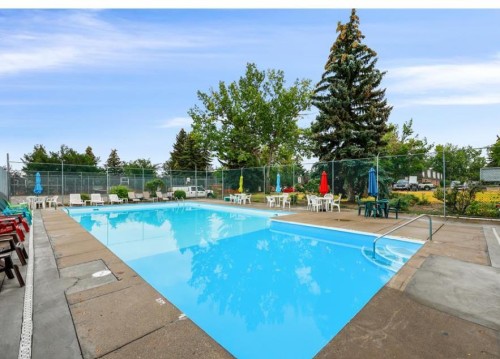 110-330 Canterbury Drive Sw, Calgary, AB - Outdoor With In Ground Pool With Backyard